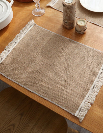 Lot de 2 sets de table isolants en jute avec pompons 